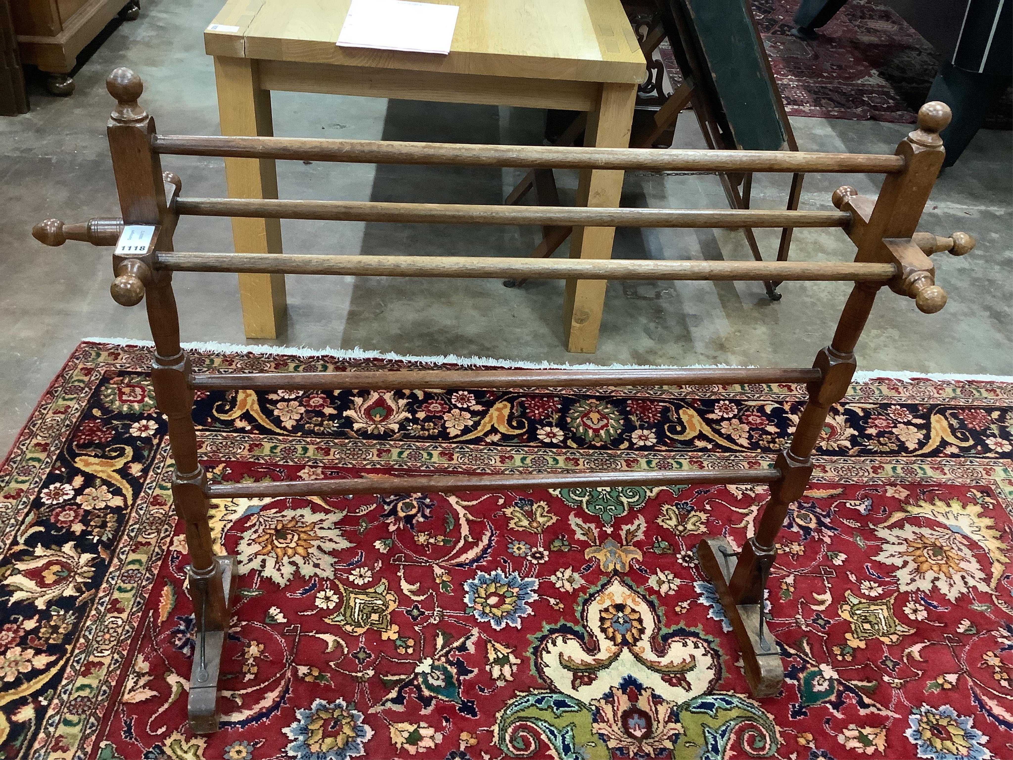 An Anglo Indian teak towel rail, width 115cm, height 96cm. Condition - fair